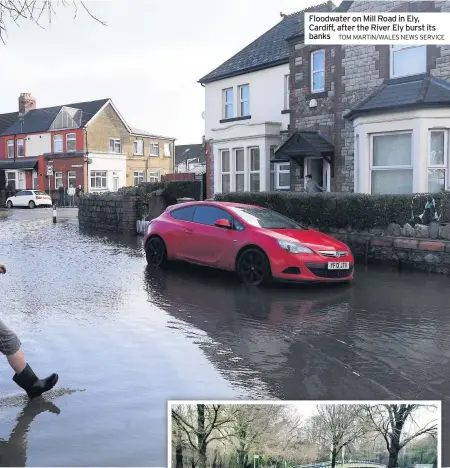  ?? TOM MARTIN/WALES NEWS SERVICE ?? Floodwater on Mill Road in Ely, Cardiff, after the River Ely burst its banks