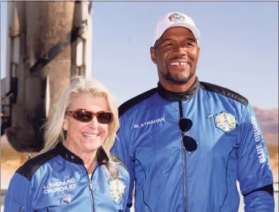  ?? LM Otero / Associated Press ?? TV celebrity and former NFL football great Michael Strahan, right poses for a photo with Laura Shepard Churchley, the oldest daughter of America’s first astronaut, Alan Shepard, after their space shot at near Van Horn, Texas on Saturday.