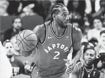  ?? ICON SPORTSWIRE VIA GETTY IMAGES FILE PHOTO ?? The Toronto Raptors, with Kawhi Leonard aboard, begin the regular season Wednesday at home against the Cleveland Cavaliers.