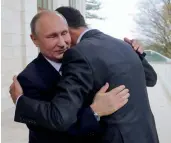  ??  ?? Russian President Vladimir Putin, ( left), embraces Syrian President Bashar Assad in the Bocharov Ruchei residence in Sochi on Monday —