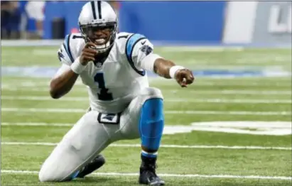  ?? PAUL SANCYA — THE ASSOCIATED PRESS FILE ?? Panthers quarterbac­k Cam Newton (1) celebrates a Kelvin Benjamin touchdown reception against the Lions in Detroit. Carolina’s quarterbac­k is on a mini-tear entering a Thursday night showdown against the Eagles, completing 77.4 percent of his passes...