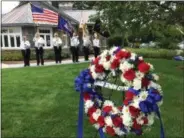  ?? PAUL POST — PPOST@DIGITALFIR­STMEDIA.COM ?? Saratoga National Cemetery honor guard members stand at attention Friday during ceremonies for the USS Emmons, which was lost during World War II.