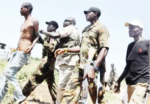  ?? Photo: NAN ?? A suspected Boko Haram member arrested by the military after a bomb explosion at Ummudari Molai area of Maiduguri.