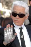  ??  ?? Fingerless fashion: The late designer Karl Lagerfeld