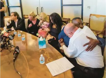  ?? Lyons’ father, Gary Lyons. RICH POPE/ORLANDO SENTINEL ?? Members of the families of Spectrum News 13 journalist Dylan Lyons and 9-year-old T’Yonna Major, who were shot and killed in Pine Hills, speak during a news conference Thursday at the NeJame Law offices in Orlando. On hand are lawyer Mark NeJame, from left; Lyons’ fiancée, Casey Lynn; Lyons’ mom, Beth Lyons; T’Yonna’s mom, Brandi Major; T’Yonna’s father, Tokiyo Major; and