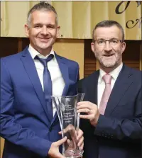  ??  ?? Paul Keogh from Bray receiving the Volunteer of the Year Award from Bryan Doyle of Wicklow County Council.