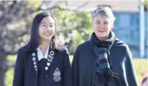  ?? PHOTO: PETER MCINTOSH ?? Summer plans . . . Otago Girls' High School year 13 pupil Will Chomchoei, of Thailand, and Otago Girls' High School principal and Study Dunedin Advisory Group chairwoman Linda Miller discuss plans for the summer break when, due to Covid19, many internatio­nal students will not return home.