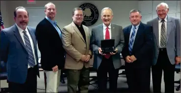  ??  ?? ACCG recognized Rep. John Meadows for his work in the Capital, notably as Chairman of the House Rules Committee. From left: Todd Edwards, ACCG, Chad Steward, Vice Chairman, Kevin Cunningham, Commission­er, Rep. John Meadows, M.L. “Bud” Owens,...