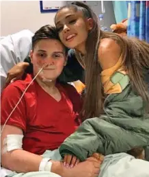  ??  ?? Hospital visitor: Adam Lawler with Ariana Grande