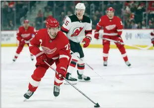  ?? PAUL SANCYA — THE ASSOCIATED PRESS FILE ?? In this Feb.
25, 2020, file photo, Detroit Red Wings center Dylan Larkin (71) skates with the puck against the New Jersey Devils in the first period of an NHL game in Detroit. The Red Wings are entering the fifth season of a rebuilding project and this still might not be the year that they break through and make the playoffs.