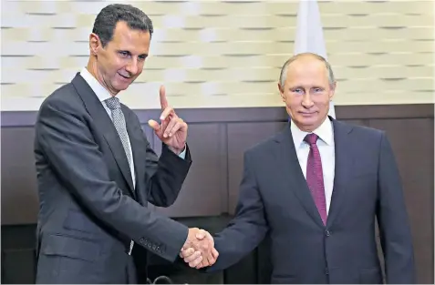  ??  ?? President Vladimir Putin with Syria’s Bashar al-assad during a secret visit to the Black Sea resort of Sochi ahead of today’s summit between Russia, Turkey and Iran