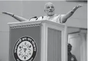  ?? — PTI ?? Prime Minister Narendra Modi addresses at the launch of the Pradhan Mantri Jan Dhan Yojana in New Delhi.