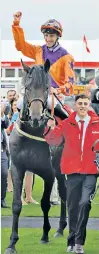  ??  ?? Star of the day: George Baker on Harbour Law after winning last year’s St Leger