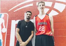 ?? THE CANADIAN PRESS/NBA ?? Canadian NBA star Jamal Murray looks like a kid next to Olivier Rioux, 12, who is 6-foot-10.