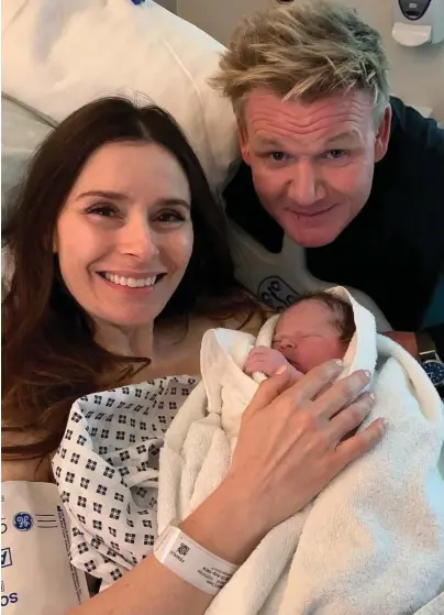  ??  ?? Little chef: Newborn Oscar James Ramsay with parents Tana and Gordon yesterday