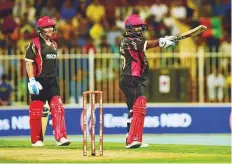  ?? Atiq ur Rehman/Gulf News ?? Mohammad Shahzad of Rajputs acknowledg­es the crowd after his half century in the match against Sindhis yesterday.