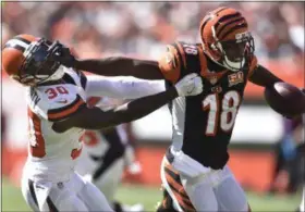  ?? DAVID RICHARD — THE ASSOCIATED PRESS ?? Bengals wide receiver A.J. Green blocks Browns defensive back Jason McCourty in the first half Oct. 1 at FirstEnerg­y Stadium.