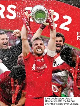  ?? ?? Liverpool skipper Jordan Henderson lifts the FA Cup after the victory over Chelsea