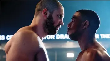  ?? MGM ?? Florian Munteanu, as Viktor Drago, left, and Michael B. Jordan as Adonis Creed, face off in Creed II.