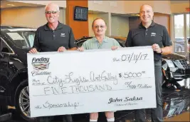  ??  ?? Findlay Cadillac Findlay Cadillac recently donated $5,000 to the City Lights Artist Co-op in Henderson. Holding the check are, from left, LJ Harness, marketing director at Findlay Cadillac; Tommy Tucker, president of City Lights Artists Co-op; and John...