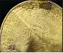  ?? ARNOLD MIKKELSEN, THE NATIONAL MUSEUM OF DENMARK VIA AP ?? The inscriptio­n ‘He is Odin’s man’ is seen in a round half circle over the head of a figure on a golden bracteate unearthed in Vindelev, Denmark in late 2020. Scientists have identified the oldest-known reference to the Norse god Odin on a gold disc unearthed in western Denmark.