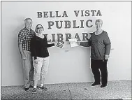  ?? Photo submitted ?? Members of the Baha'i group in Bella Vista recently donated two books on the Baha'i Faith to the Bella Vista Public Library. Bob Johnson, left, Sue Johnson and Joanne Wartchow are shown in the photo. A spokespers­on for the group noted that because not...