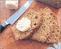  ?? ELIZABETH KARMEL VIA AP ?? Wheaten bread with sweet scotch whiskey butter from a recipe by Elizabeth Karmel.