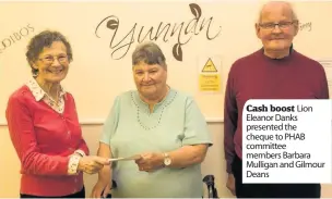  ??  ?? Cash boost Lion Eleanor Danks presented the cheque to PHAB committee members Barbara Mulligan and Gilmour Deans