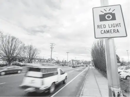  ??  ?? A sign on Shelbourne Street warns of a red-light camera as drivers approach the Hillside Avenue intersecti­on. The other red-light camera in the Greater Victoria area is at the intersecti­on of Tillicum Road and the Trans-Canada Highway.
