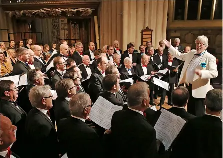  ?? ?? The City of Bath Male Choir with their conductor Grenville Jones in the historic Bath Abbey