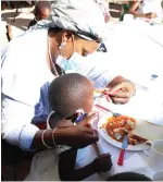  ?? — Picture: John Manzongo ?? First Lady Auxillia Mnangagwa serves breakfast to children at Queen Elizabeth Children’s Home in Bulawayo yesterday.