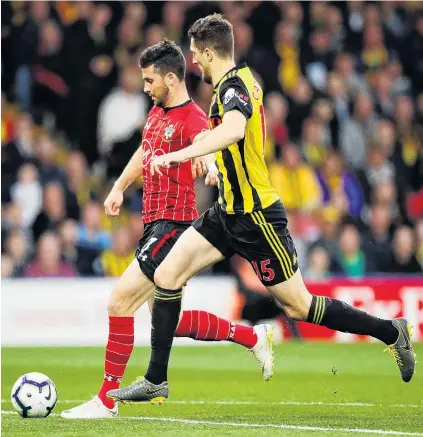  ?? PHOTO: REUTERS ?? Long shot . . . Southampto­n striker Shane Long outpaces Watford defender Craig Cathcart to score his team’s only goal after just 7.69 seconds during their English Premier League match at Vicarage Road in Watford yesterday. Long had charged down Cathcart’s attempted clearence just moments after kick off.