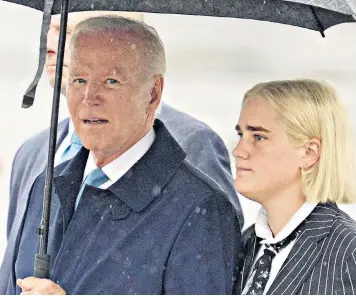  ?? ?? Joe Biden with Maisy, his granddaugh­ter, as they arrive in Iwakuni ahead of the G7 summit in Japan