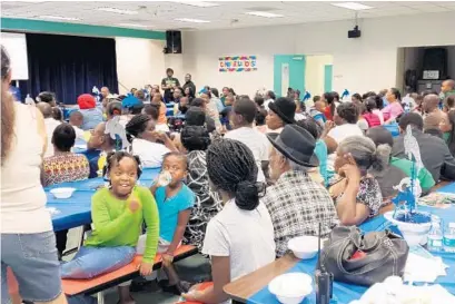  ?? SUBMITTED PHOTO ?? Broward County families learn how to turn meal time into family time through the Hot Food Hot Topics/Fresh Food Fresh Ideas summer series.