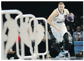  ?? — AP PHOTO ?? Nuggets’ Nikola Jokic moves down the court during the all-star skills contest Saturday night.