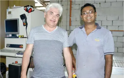  ?? Photo: LITIA TIKOMAILEP­ANONI ?? From left: One of the four machine operators at Furniture Artis Joinery, from Ukraine joiner Reenal Chandra at their factory in Nadi.