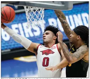  ?? (AP/Mark Humphrey) ?? Arkansas forward Justin Smith drives to the basket Friday against Missouri’s Mitchell Smith during the No. 8 Razorbacks’ 70-64 victory over the Tigers in the quarterfin­als of the SEC Tournament in Nashville, Tenn. Justin Smith continued his efficient play of late, finishing with 16 points, 8 rebounds, 3 assists and 2 steals. More photos at arkansason­line.com/313uasec/.