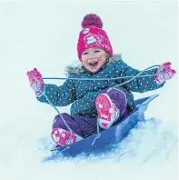  ??  ?? Clockwise from top left: the car park is chock-a-block with visitors; Sandra Szydlowska, 4, from Perth holds on tightly; a mountain hare blends in with the snow; dad Gavin Belton teaches son Luke, 5, how to snowboard; Olivia Cuthbert, 3, from Bridge of...