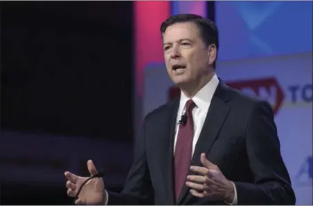  ?? SUSAN WALSH — THE ASSOCIATED PRESS ?? FBI Director James Comey speaks in Washington. A person familiar with the investigat­ion into Hillary Clinton’s use of a private email server says Huma Abedin did not forward “hundreds and thousands” of emails to her husband’s laptop, as FBI Director...