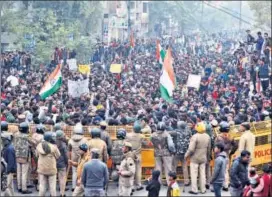  ??  ?? Demonstrat­ors gather during a protest against the CAA on Tuesday to show solidarity with the students of the Jamia Millia Islamia university. REUTERS