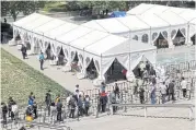  ?? ?? People line up outside a makeshift coronaviru­s testing site of Beijing on May 2.