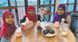  ??  ?? St Margaret Mary's College student Sadia Shareef with her sisters, Noor and Maryam.