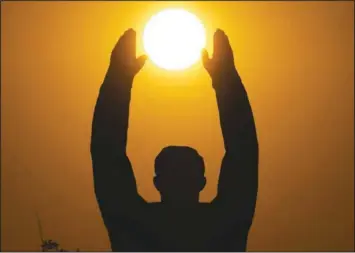  ?? (AP/Dmitri Lovetsky) ?? The sun sets over a statue of Gagarin at the Baikonur cosmodrome in Kazakhstan.