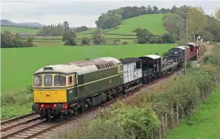  ?? PETER NICHOLSON ?? Seen on the return working from Norton Fitzwarren to Minehead approachin­g Williton on October 29, is DEPG’s Class 33 No. D6575 on the last revenue-earning duty of the season. This was a diesel driver experience course, the first for three years, fulfilling bookings taken in 2019. This was also the first diesel-worked heritage goods train run since then and included several wagons restored by the WSR wagon group in the interim.