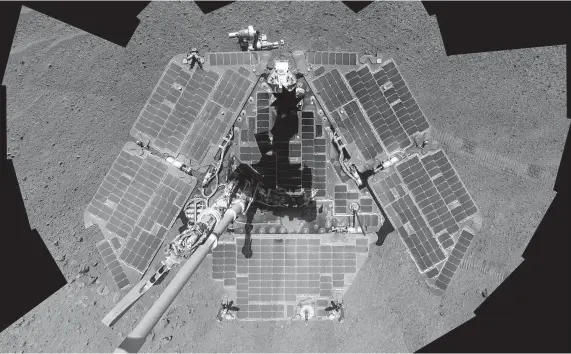  ?? NASA ?? A self-portrait taken by NASA’s Opportunit­y rover in March 2014 shows that wind had blown off much of the Martian dust that had covered its solar panels.