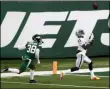  ?? NOAH K. MURRAY - THE ASSOCIATED PRESS ?? Las Vegas Raiders’ Henry Ruggs III, right, catches a touchdown during the second half an NFL football game against the New York Jets, Sunday, Dec. 6, 2020, in East Rutherford, N.J.