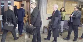  ?? ANDREW VAUGHAN / THE CANADIAN PRESS ?? Interested parties head into Nova Scotia Supreme Court last week in the QuadrigaCX case. A judge is expected to decide Thursday who will represent the creditors.