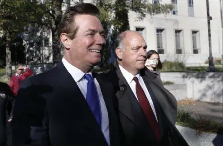  ?? ALEX BRANDON — THE ASSOCIATED PRESS ?? Paul Manafort, left, leaves Federal District Court in Washington, Monday. Manafort, President Donald Trump’s former campaign chairman, and Manafort’s business associate Rick Gates pleaded not guilty to felony charges of conspiracy against the United...