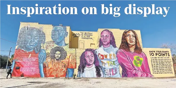  ?? ANALIS BAILEY/ USA TODAY SPORTS ?? A mural was unveiled Wednesday in Old West Tampa titled “Change the Whirled” by artist Brandan “BMike” Odums in collaborat­ion with Ben & Jerry’s and Colin Kaepernick’s Know Your Rights Camp.