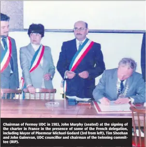  ?? ?? Chairman of Fermoy UDC in 1983, John Murphy (seated) at the signing of the charter in France in the presence of some of the French delegation, including Mayor of Ploemeur Michael Godard (3rd from left), Tim Sheehan and John Guinevan, UDC councillor and chairman of the twinning committee (RIP).